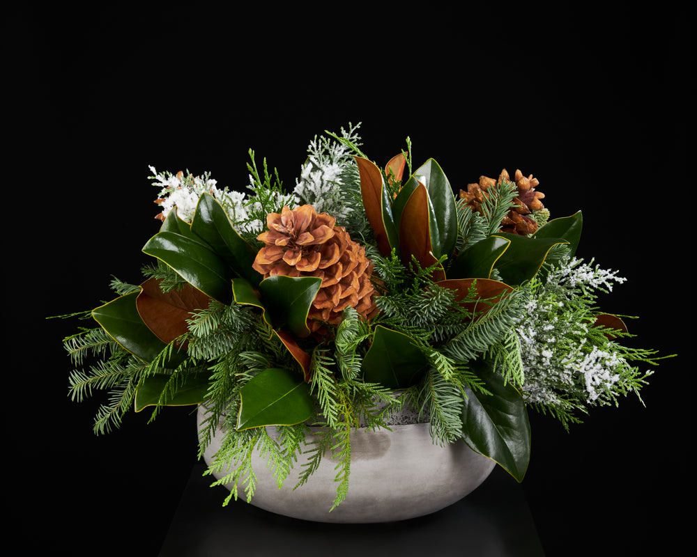 Magnolia Leaves, Cedar, Pine, Large Pine Cones and faux frosted cedar. Cement Bowl.