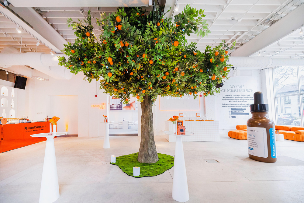 Orange tree installation at the SkinCeuticals event